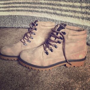 Light brown/tan boots. Timberland like
